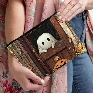 Detail view of the Halloween ghost zipper pouch showing cute window design and smooth black zip.