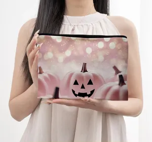 Pink Halloween pumpkin print makeup bag, cute cosmetic storage pouch with secure zipper closure.