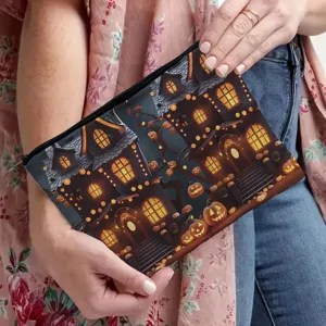 Detail view of Halloween haunted house print canvas zipper makeup pouch and clutch bag.