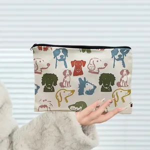 Cute canvas cosmetic bag with adorable colorful dog prints, ideal for travel and daily use.