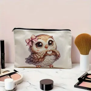 Canvas cosmetic bag with cute owl pattern, zip closure, portable makeup pouch for daily use.