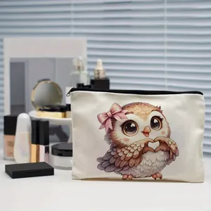 Canvas cosmetic bag with cute owl graphic, perfect for makeup storage and daily organization.