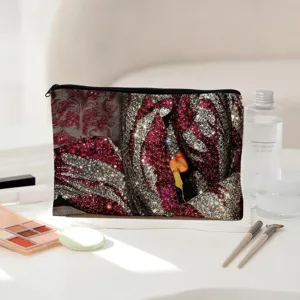 Canvas cosmetic bag with glitter pattern, stylish storage pouch for makeup and stationery.