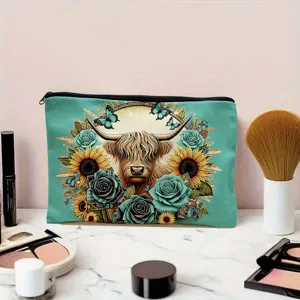Close-up detail of teal canvas cosmetic bag featuring highland cow floral print and black zipper.