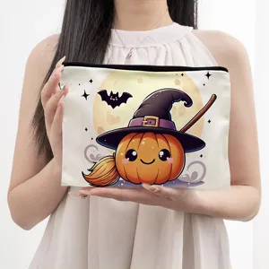 Halloween pumpkin witch cosmetic bag, cute cartoon canvas zipper pouch for daily makeup storage.