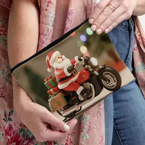 Close-up detail view of Christmas Santa Claus motorcycle print cosmetic pouch with black zipper.