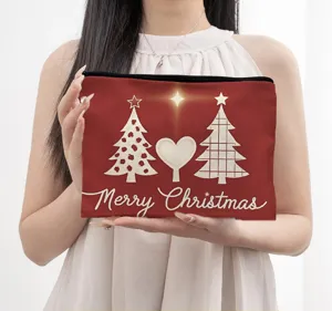 Detailed view of red Christmas cosmetic pouch, linen material, zipper closure, holiday print.