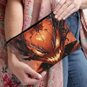 Canvas zipper makeup pouch detail showing artistic spooky pumpkin illustration and clean stitching.