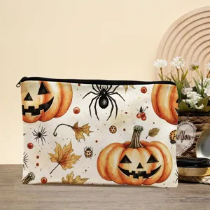 Close-up detail of the Halloween autumn pumpkin and spider print canvas makeup storage bag.