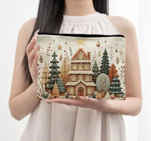 Detailed close-up view of the Christmas gingerbread house printed canvas cosmetic storage bag.