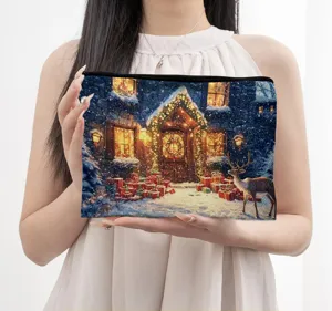 Detailed view of the digital printed zipper pouch featuring a charming winter snowy cottage.