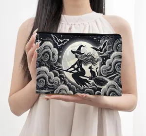 Portable canvas cosmetic bag with witch and moon print, ideal for travel and daily storage use.