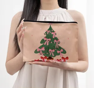 Close-up detail of the festive Christmas tree print canvas makeup bag showcasing fine texture.