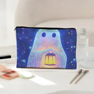 Close-up detail view of the oil painting style ghost cosmetic pouch on the clean desk.