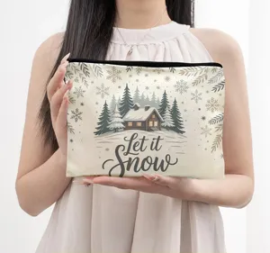 Close-up detail of winter snow cabin print linen cosmetic storage bag and coin purse.
