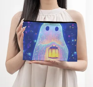 Detail shot of canvas cosmetic pouch with starry ghost art, zipper closure, daily use makeup bag.