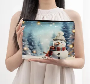 Close-up detail view of Christmas snowman cosmetic bag featuring lovely winter print design.
