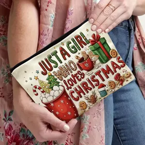 Detail shot of a festive Christmas canvas makeup pouch with zipper closure and holiday print.