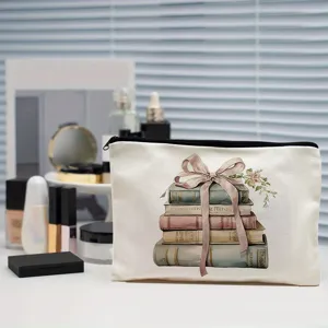 Canvas makeup pouch with vintage stacked books and bow print, ideal cosmetic storage bag.