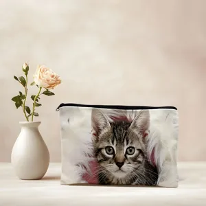 Cute tabby kitten print cosmetic bag detail, featuring soft fabric and smooth zipper closure.