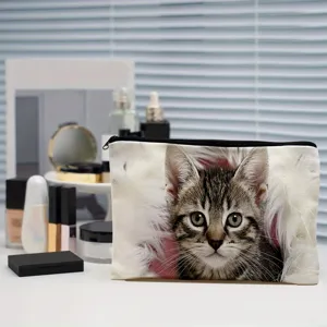 Closeup detail view of cute cat print cosmetic makeup pouch featuring smooth black zipper and soft fabric.