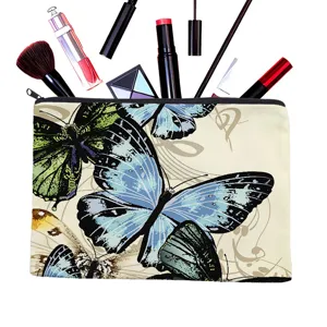 Canvas cosmetic bag featuring elegant blue butterfly prints, large capacity travel makeup pouch.