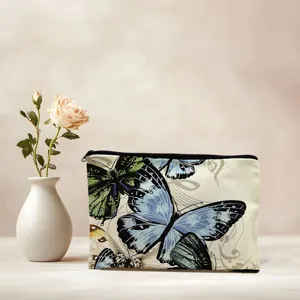 Detailed view of a stylish canvas makeup bag featuring a stunning colorful butterfly print.