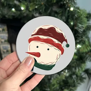 Round silicone car coaster with cute snowman pattern, anti-slip insulated cup mat detail.