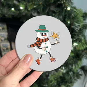 Detailed close-up view of the retro cartoon snowman design on a round cup coaster.
