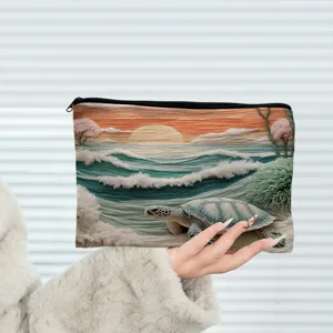 Detailed view of a portable canvas zipper pouch featuring a charming sea turtle beach art print.