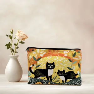 Closeup detail of the double-sided printed cat cosmetic pouch, showing vibrant autumn foliage design.