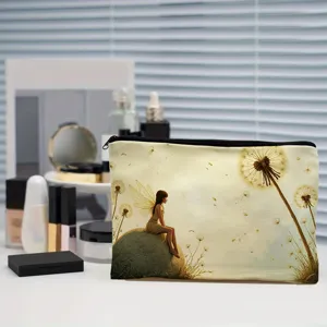 Detailed shot of a canvas makeup pouch featuring a fantasy fairy and dandelion print design.