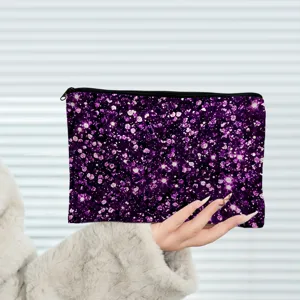 Purple glitter cosmetic bag detail view showing vibrant sparkle pattern and secure zipper closure.