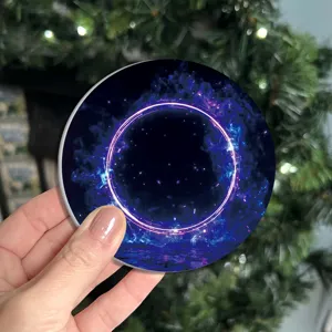 Round silicone coaster with glowing cosmic ring design, heat resistant cup mat for home office.