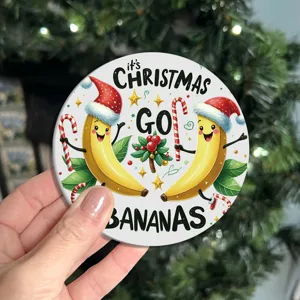 Round silicone cup coaster with Christmas banana graphic, heat-resistant mat for home and car.