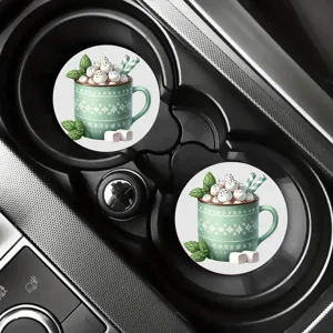 Car cup holder detail showing two round coasters with festive green Christmas mug design.