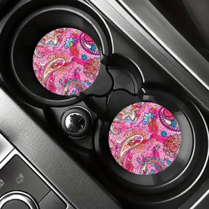 Vibrant pink paisley car cup coasters, silicone anti-slip drink mats for auto interior decor.
