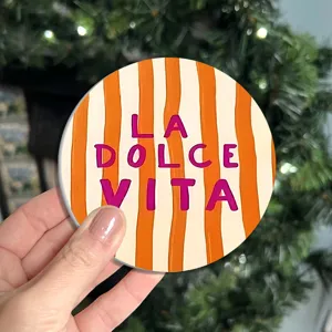 Sottobicchiere rotondo in silicone tappetino isolante con strisce arancioni e testo dolce vita