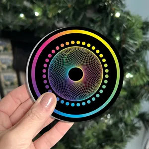 Silicone coaster detail showing colorful geometric rainbow pattern on black for table decor.