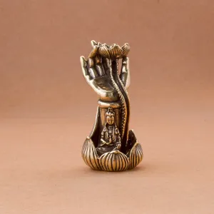 Brass lotus hand backflow incense burner, exquisite carved Buddha craft detail display.