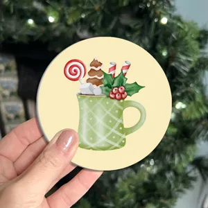 Christmas coffee cup coaster detail featuring cute holiday mug illustration and festive design