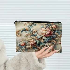 Detailed view of a vintage oil painting floral canvas cosmetic bag with secure zipper closure.