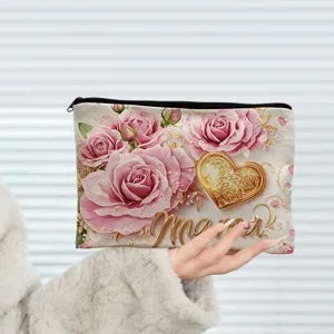 Borsa cosmética estuche de lona con rosas rosadas y estampado de corazón dorado, detalle de estuche.
