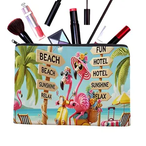 Canvas cosmetic bag detail showing vibrant flamingo beach print and secure zipper for travel storage.