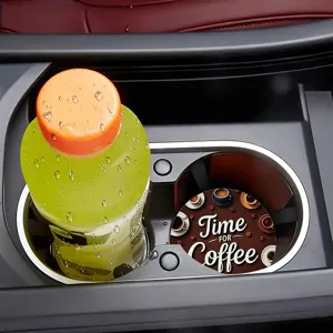 Car cup holder coaster detail showing non-slip silicone material and coffee pattern in console.