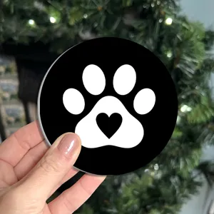 Cute black silicone car coaster featuring a cute white paw print and heart detail.