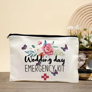 Detail view of white canvas wedding emergency kit cosmetic pouch with floral watercolor art.