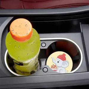Car cup coaster detail showing cute cartoon elephant print and anti-slip car interior mat.