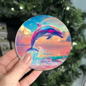 Round dolphin print coaster detail view, vibrant colorful sunset sea design for home table decor.