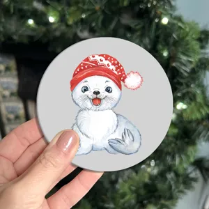 Carino sottobicchiere di foca di Natale, bel tappetino per tazze di design animale per la tavola.